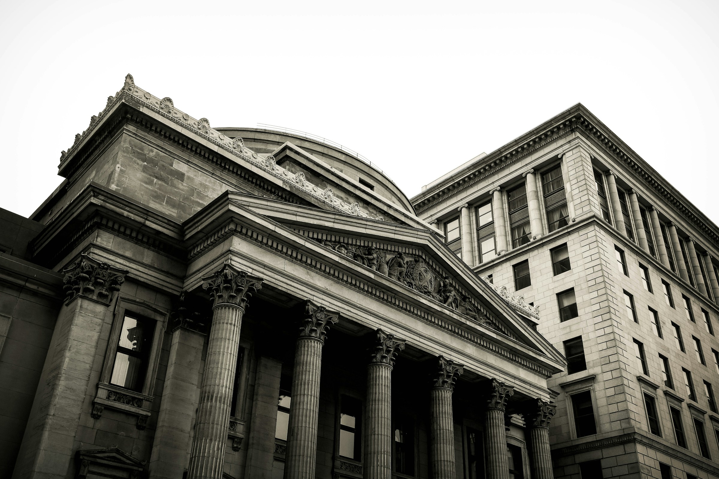 Image of an older bank in the skyline with the angle being shot from below.